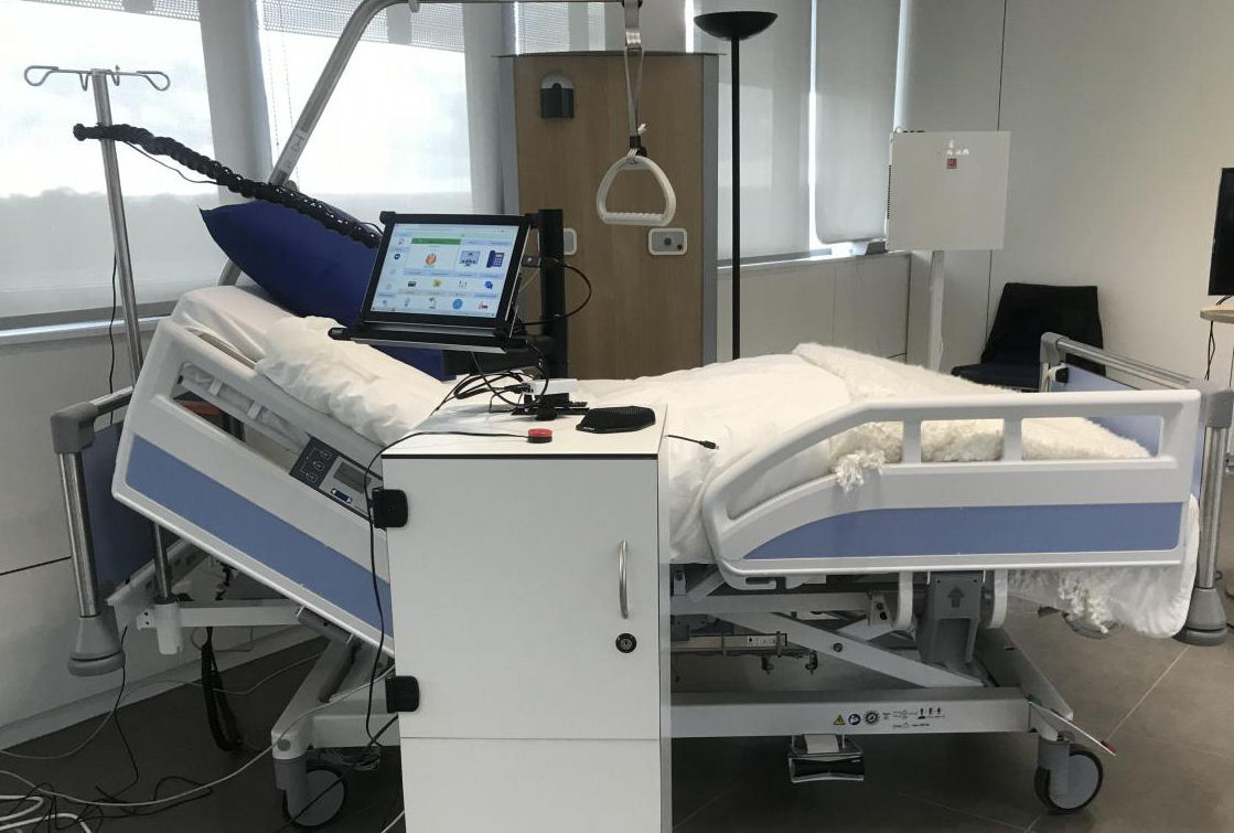 Soline Mobile next to a medical bed